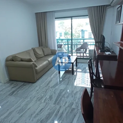 Ruang tamu apartemen Pavilion sewa 1BR dengan tata ruang semi modern.